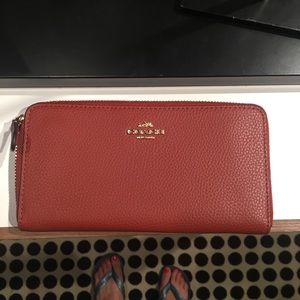 Rectangular auburn zip wallet coach